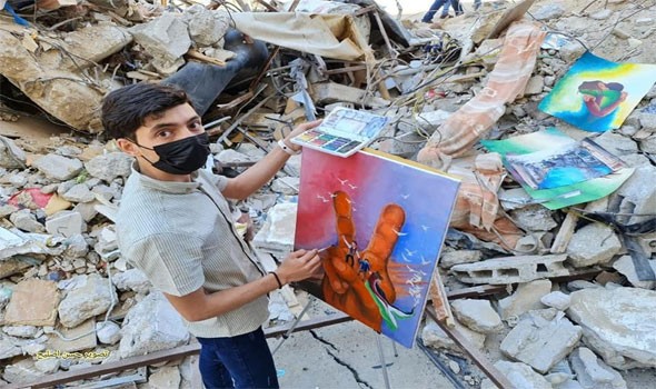 فنان فلسطيني يجسد بريشته ملامح العدوان الأخير على غزّة